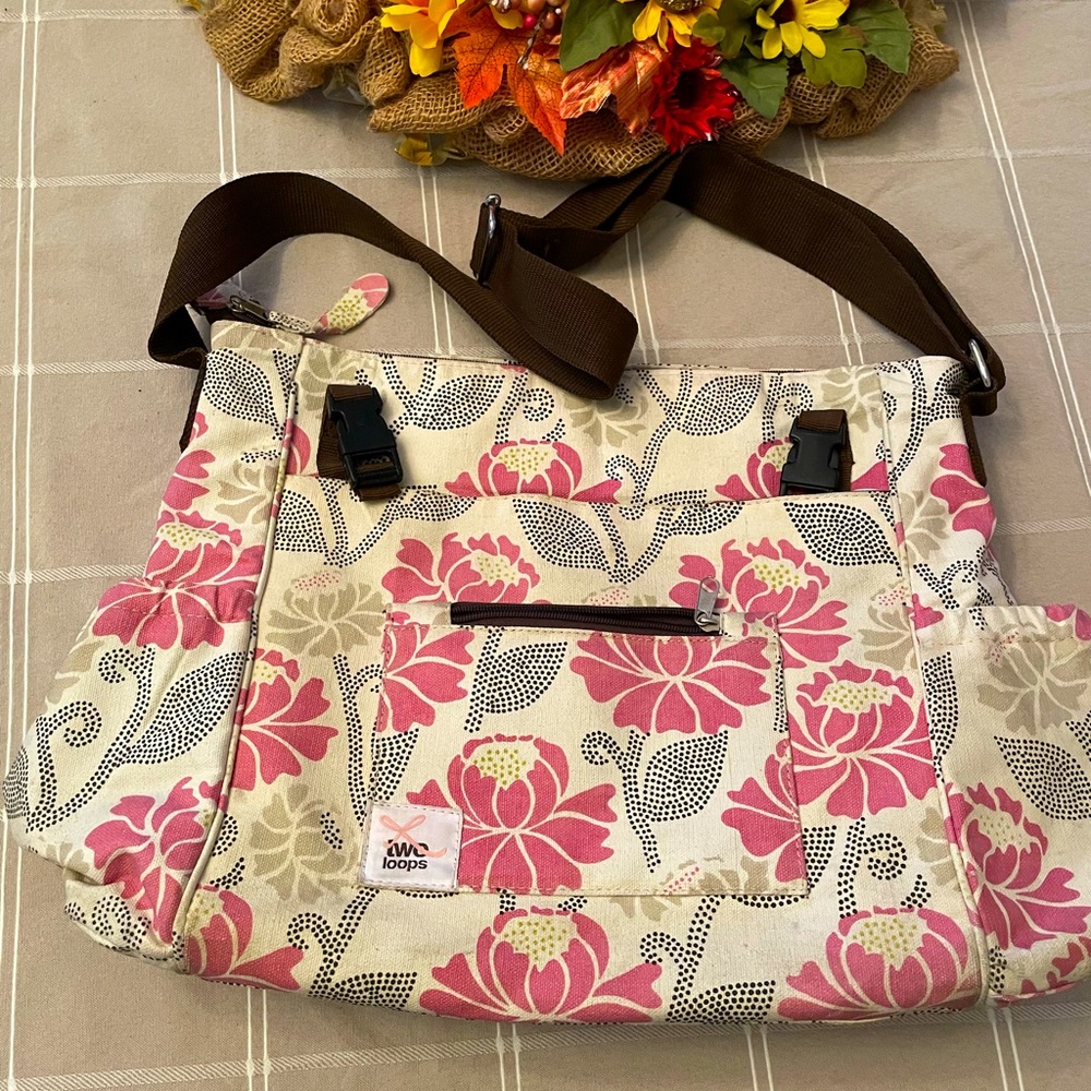 Two Loops Diaper Bag in a Pink Floral Pattern.